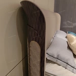 Panel-Stitched Leather Bed with Top Strap Details and High-Gloss Wooden Sides